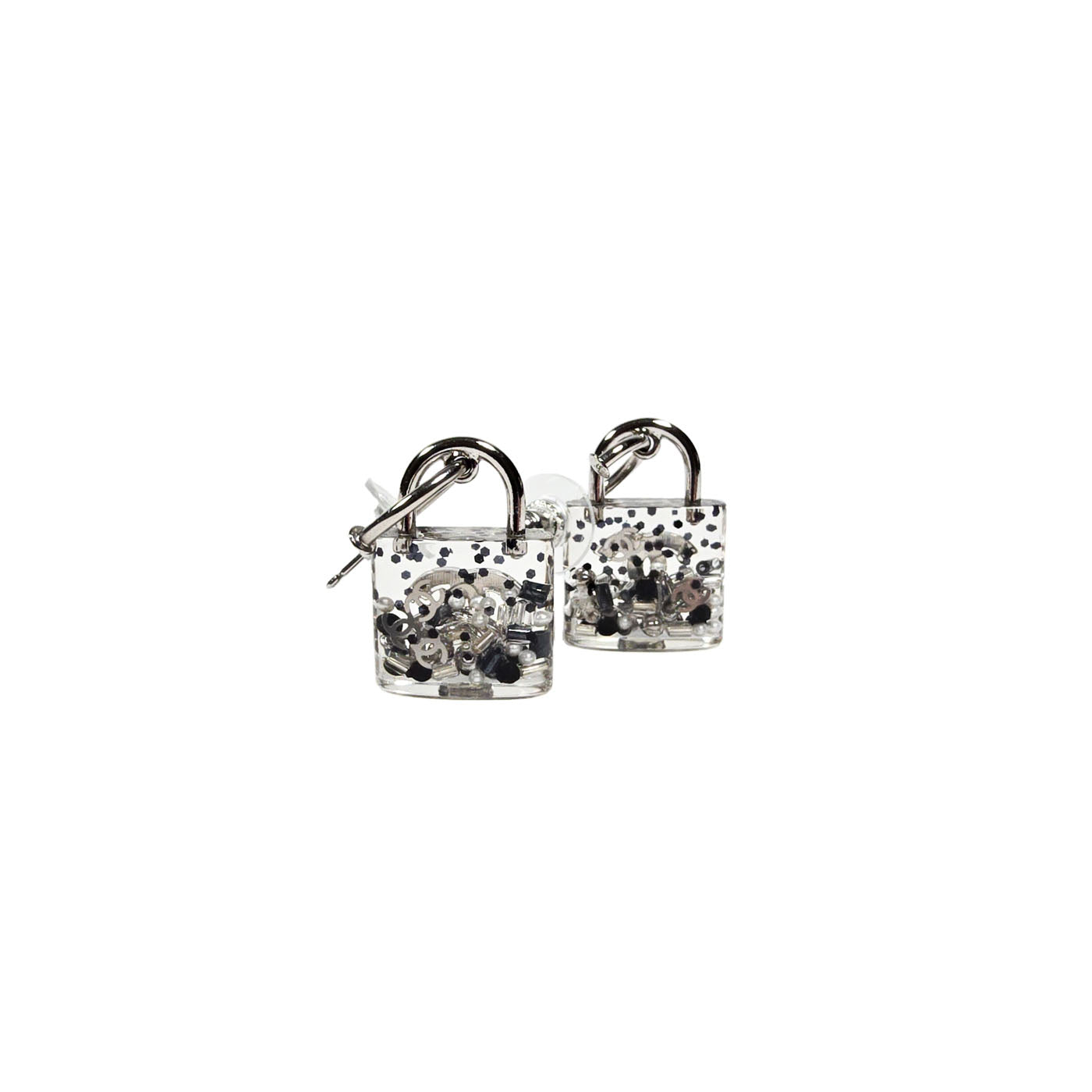 A pair of Chanel CC logo pad lock style earrings with translucent resin inclusion, featuring silver tone hardware.