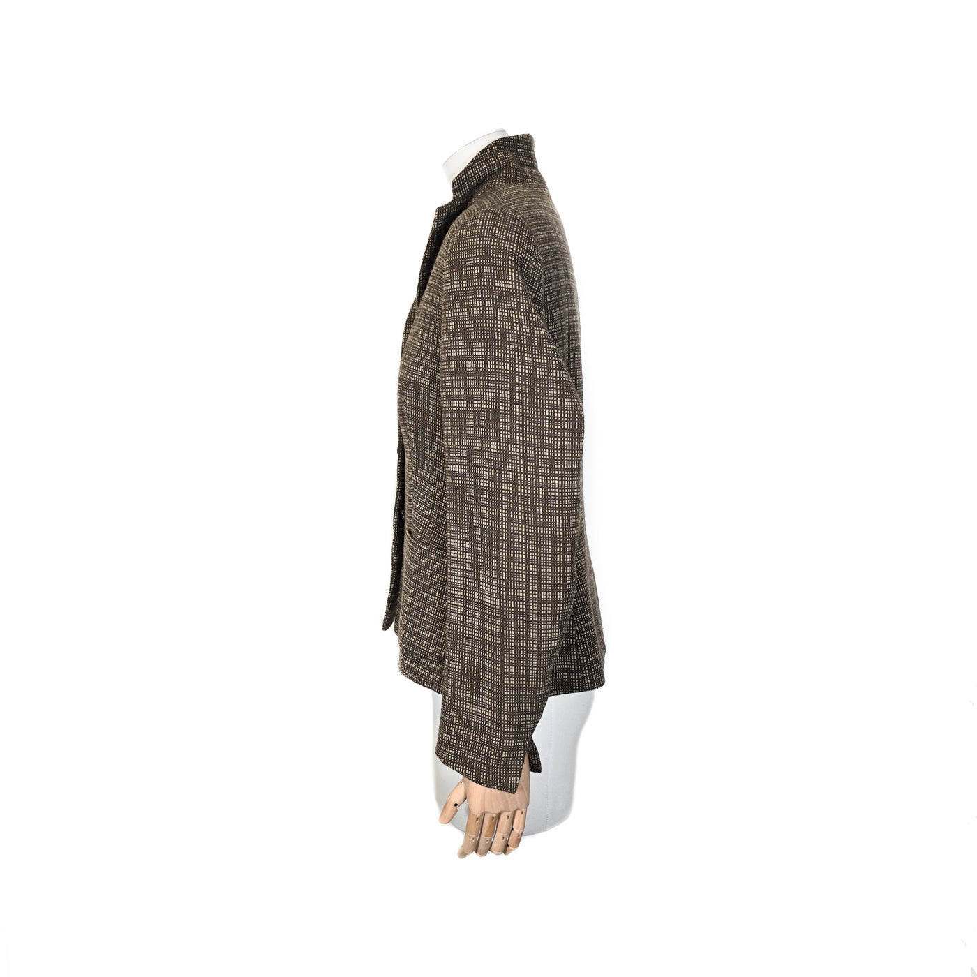 A brown checkered NATAN jacket on a mannequin, displaying a classic design suitable for both city and countryside wear.