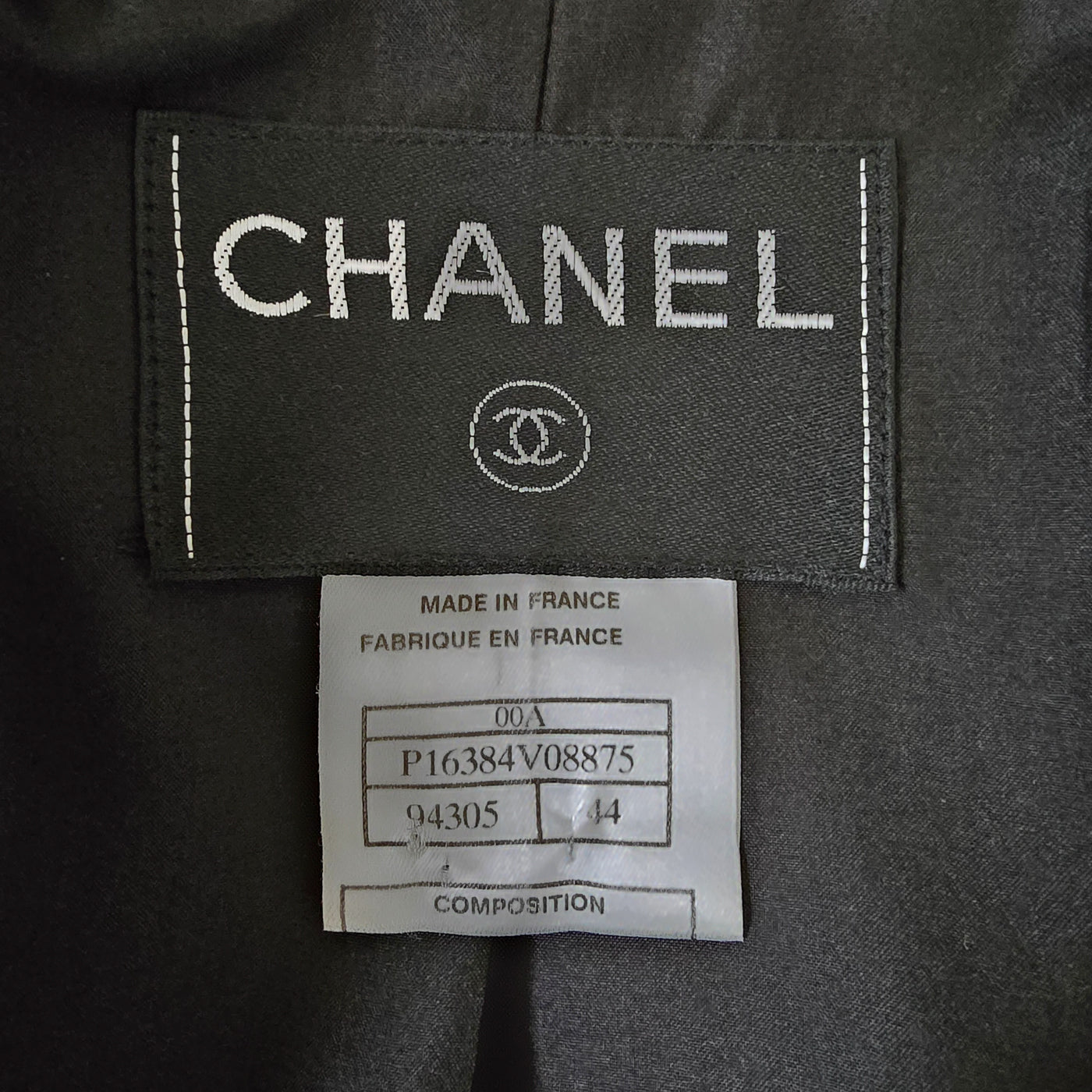 Vintage Chanel Cashmere Jacket in black and blue mixed cashmere blend with multiple front pockets, embossed zipper, and interlocking CC manchette detail.