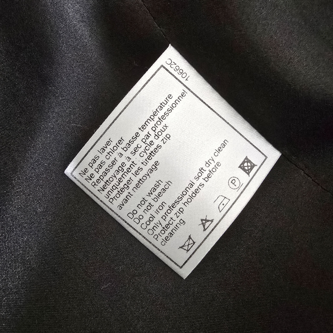 Vintage Chanel Cashmere Jacket in black and blue mixed cashmere blend with multiple front pockets, embossed zipper, and interlocking CC manchette detail.