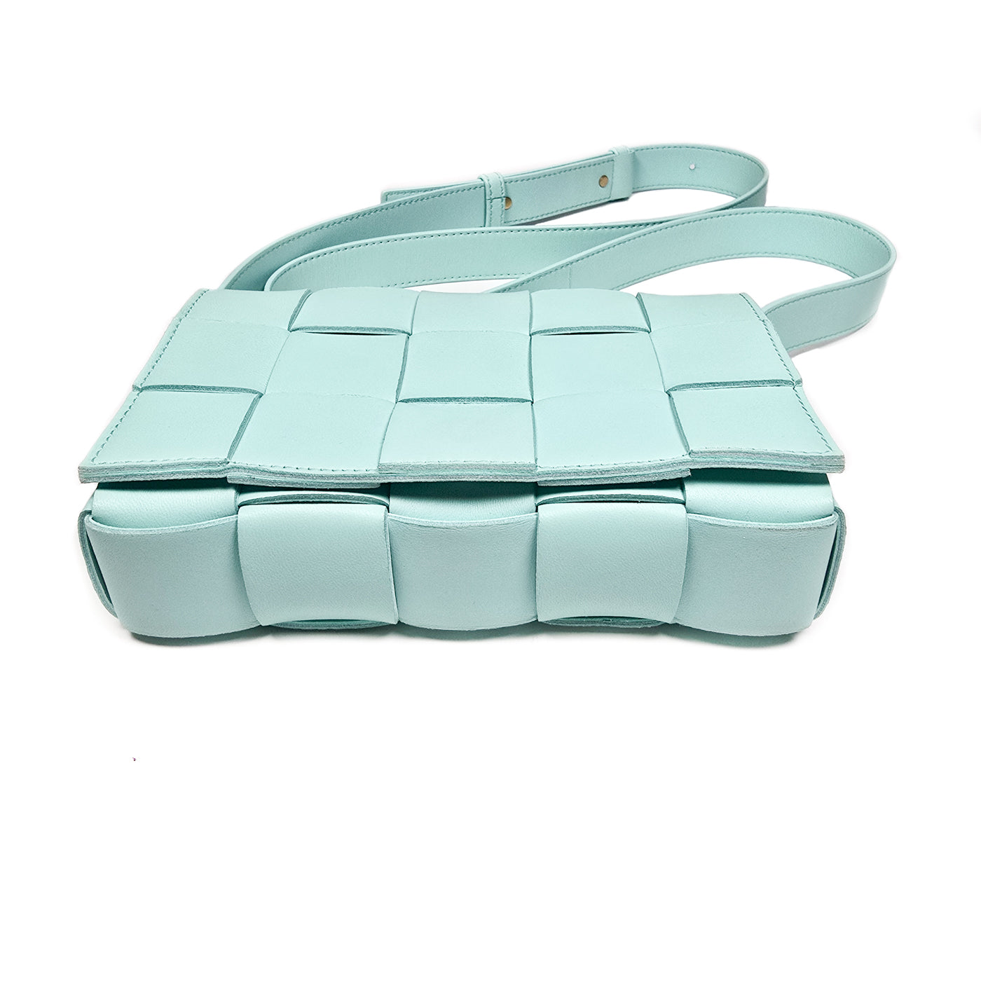 A Bottega Veneta lambskin leather crossbody bag in Tiffany blue with aged gold hardware accents, displayed against a white background.