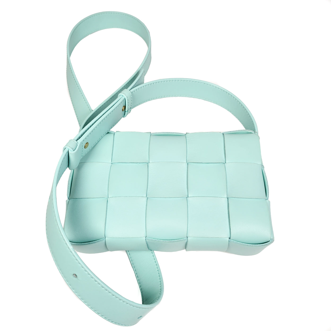 A Bottega Veneta lambskin leather crossbody bag in Tiffany blue with aged gold hardware accents, displayed against a white background.