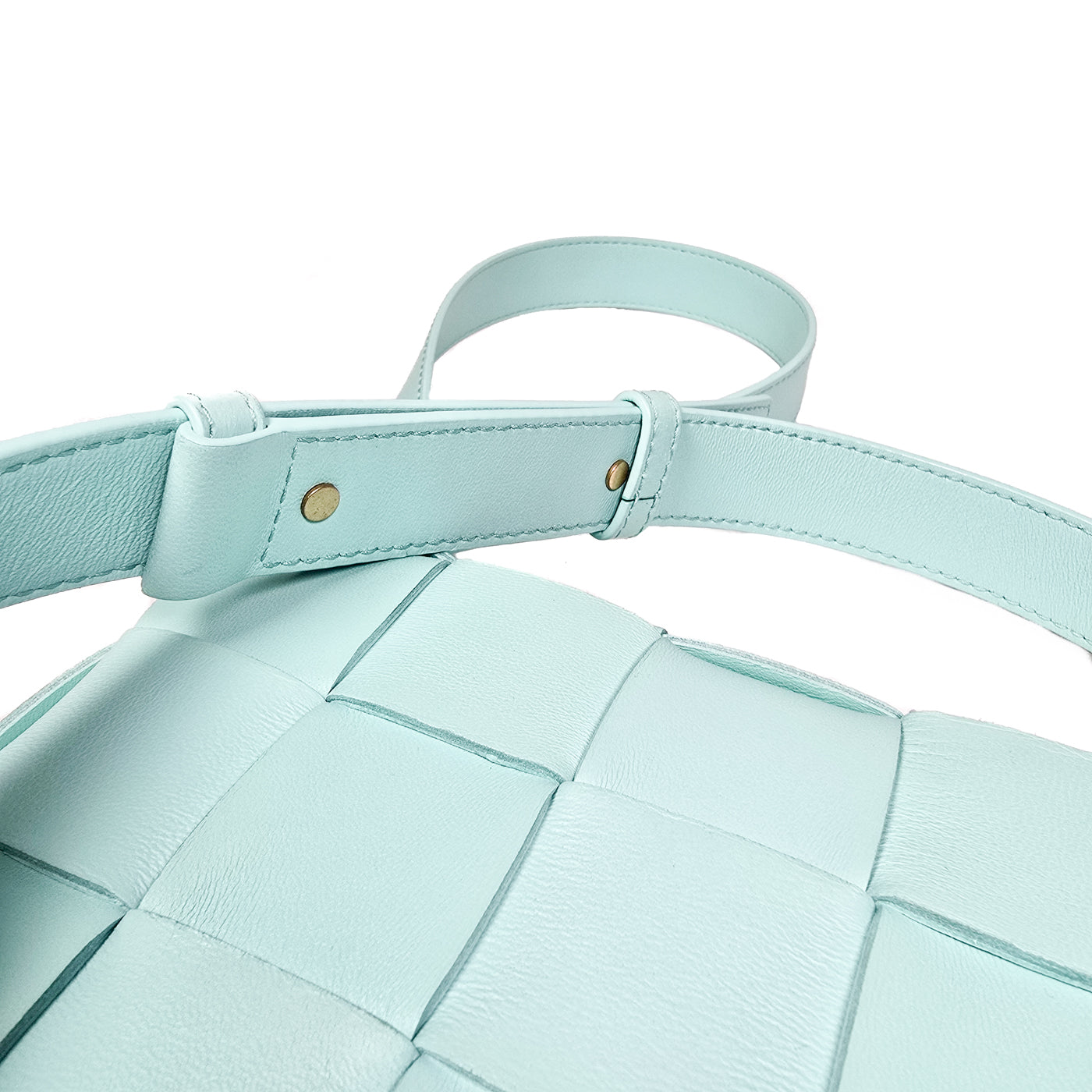 A Bottega Veneta lambskin leather crossbody bag in Tiffany blue with aged gold hardware accents, displayed against a white background.