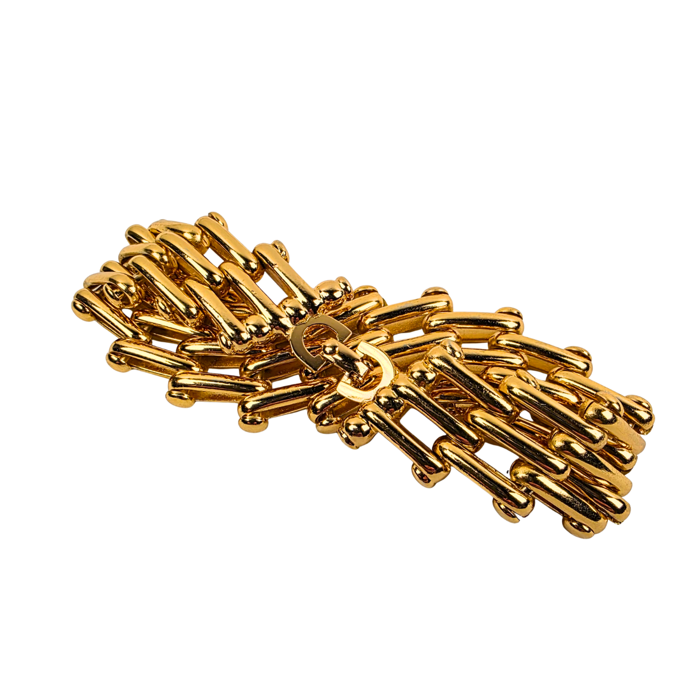 Golden vintage Christian Dior chain bracelet on a white background