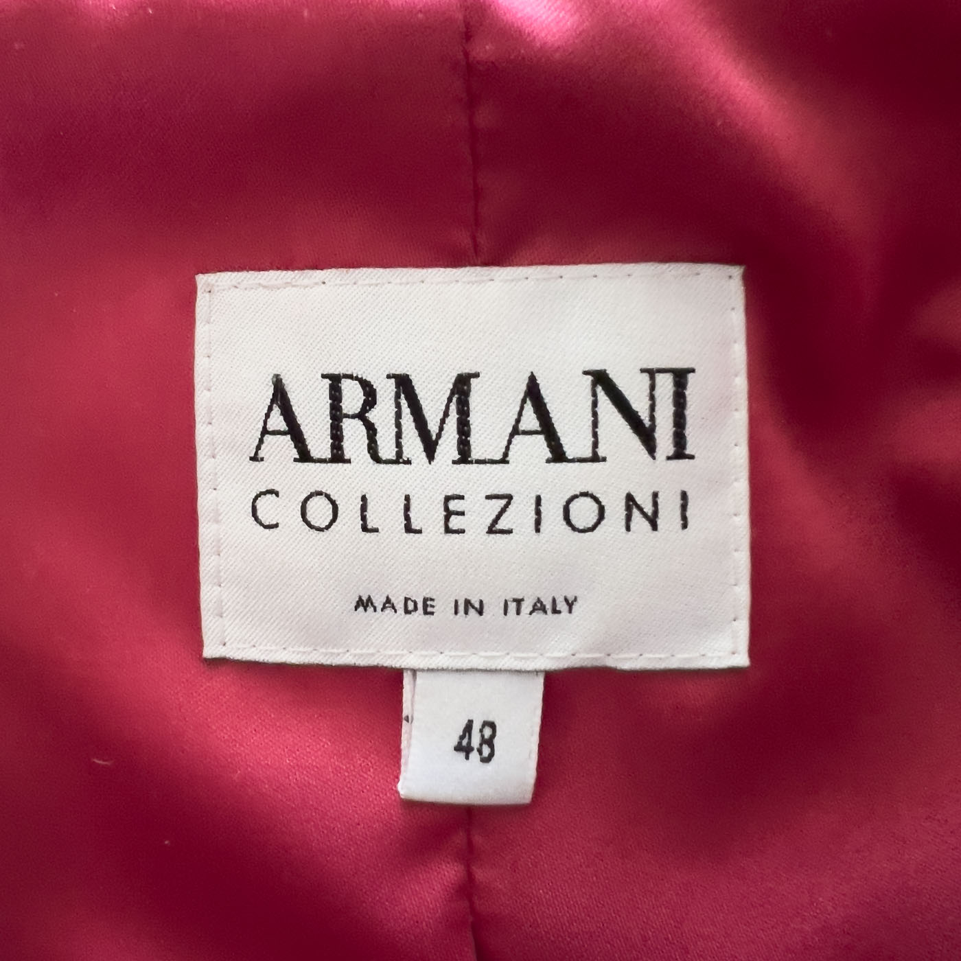 Vintage Armani tweed jacket in multicolor with a pink silk lining, displayed on a mannequin.