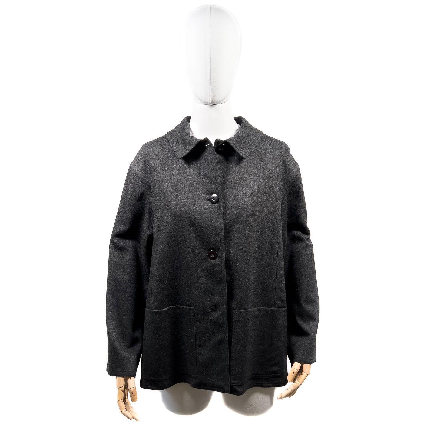 An Authentic Vintage Oscar de la Rente black jacket displayed on a mannequin.