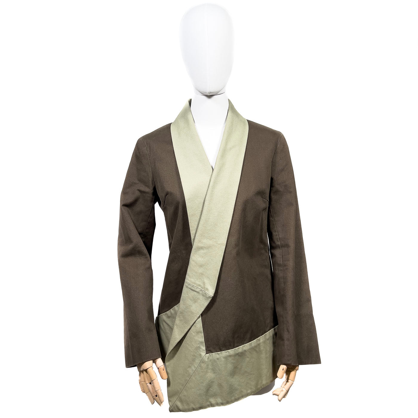 A vintage Dries Van Nooten blazer jacket on a mannequin, featuring a brown and green color scheme with a lapel.