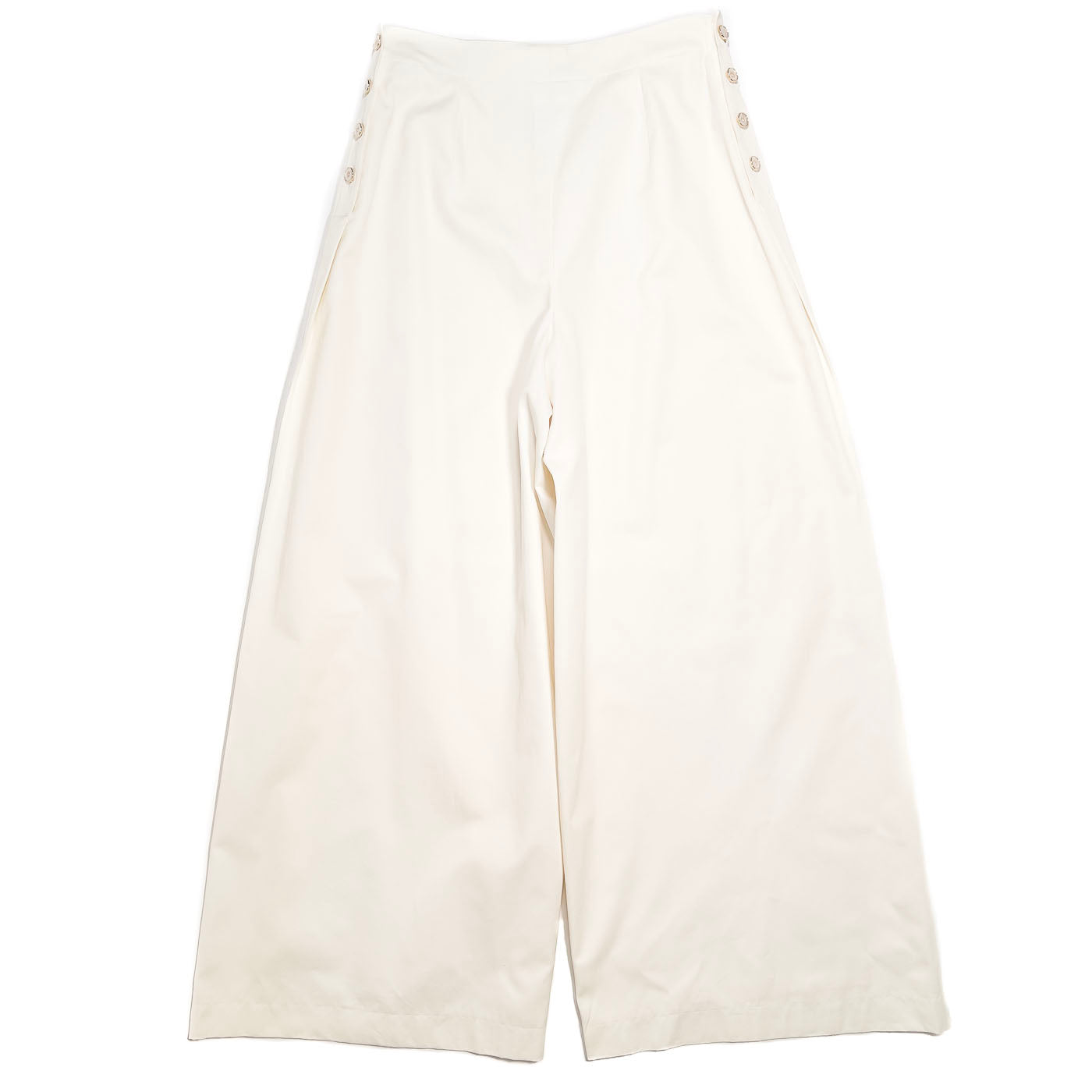 A pair of vintage Chanel Boutique ivory white trousers with button accents, displayed on a plain background.