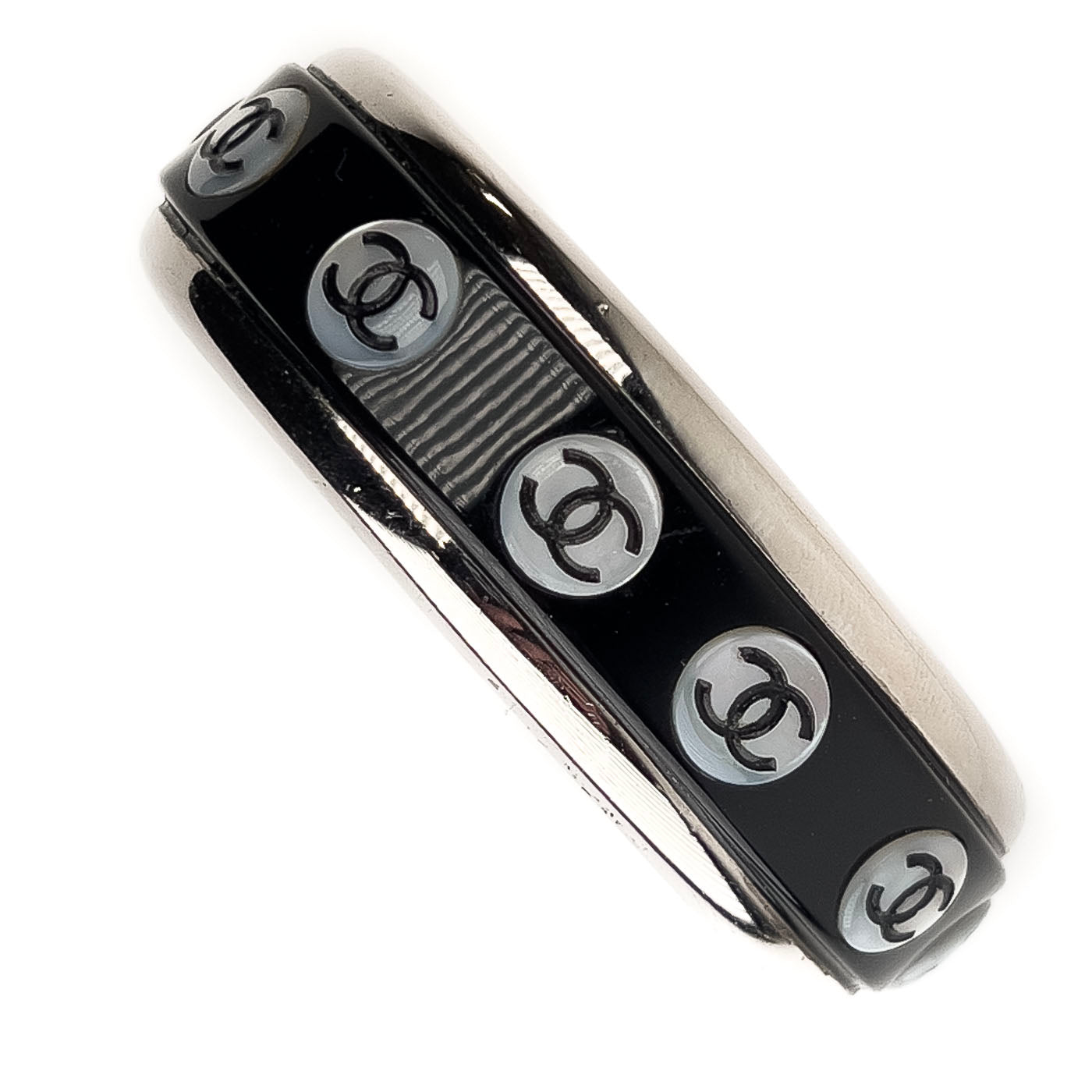 A vintage Chanel Mother of Pearl CC Cuff bracelet in silver tone with black lacquer and mother of pearl pastille CC inlays.