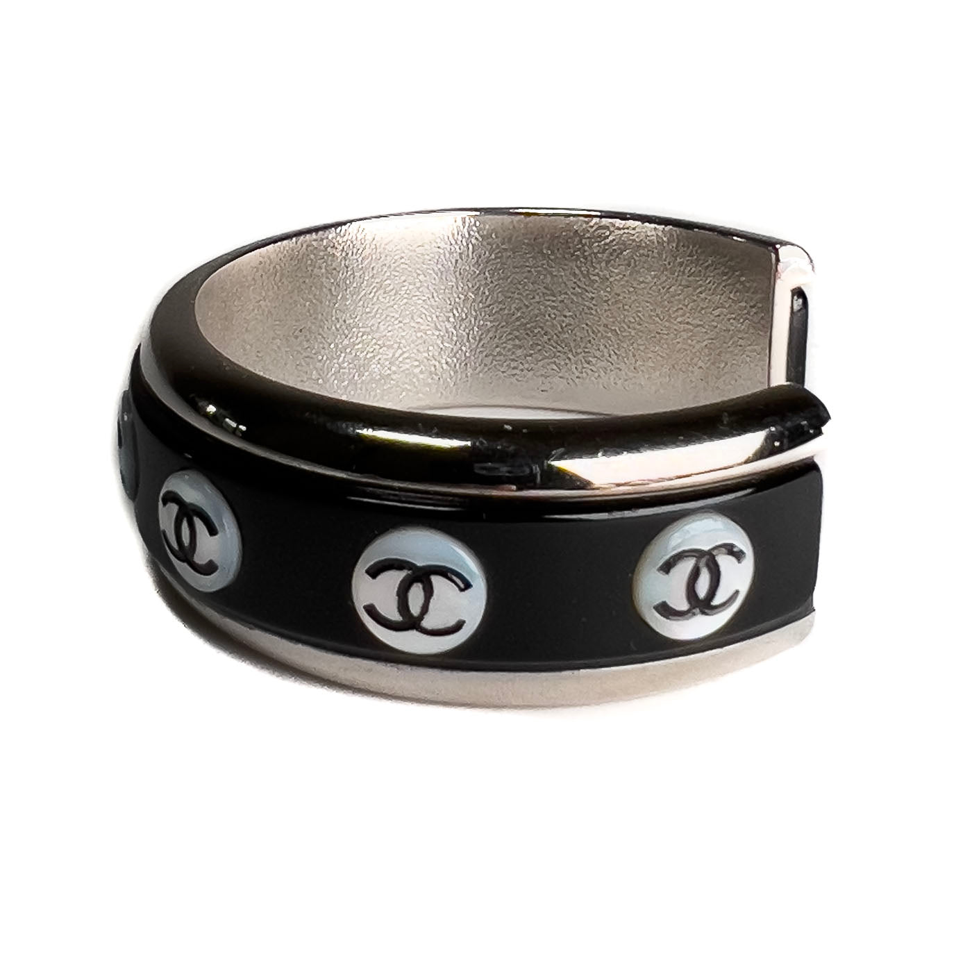 A vintage Chanel Mother of Pearl CC Cuff bracelet in silver tone with black lacquer and mother of pearl pastille CC inlays.