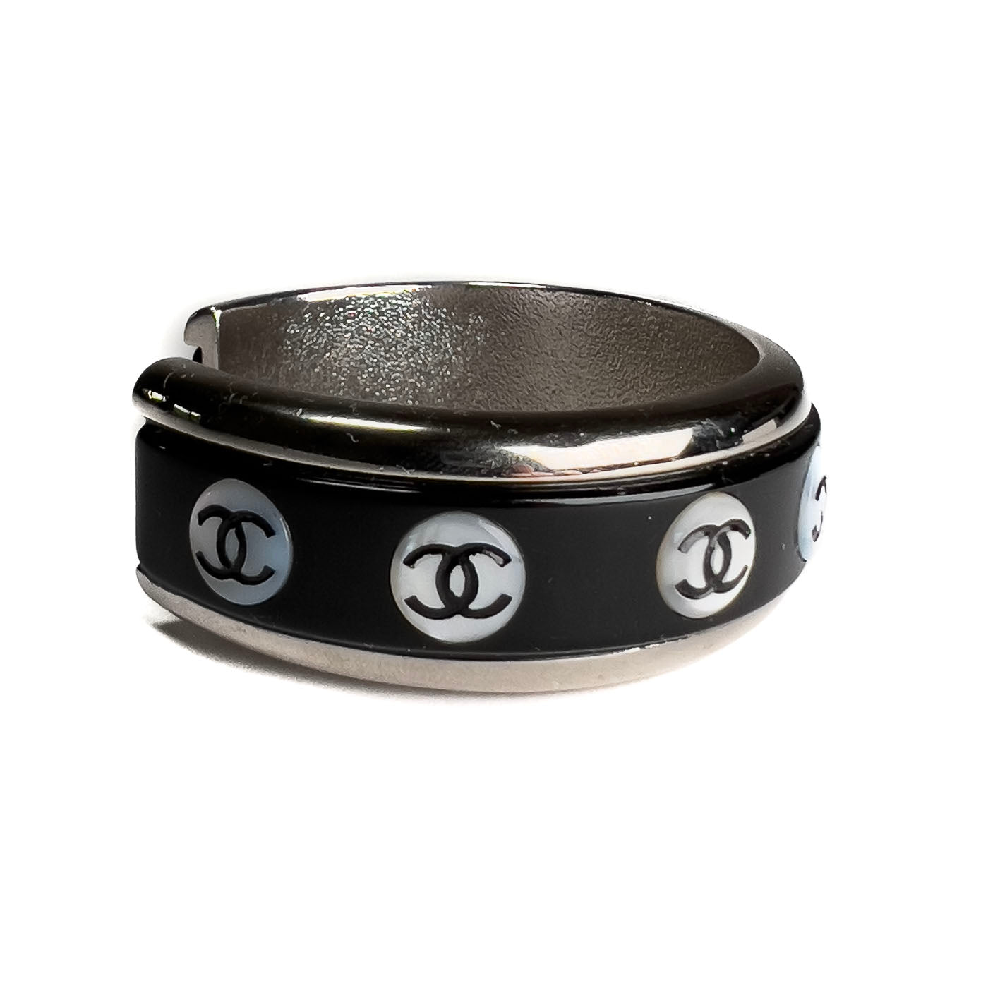 A vintage Chanel Mother of Pearl CC Cuff bracelet in silver tone with black lacquer and mother of pearl pastille CC inlays.