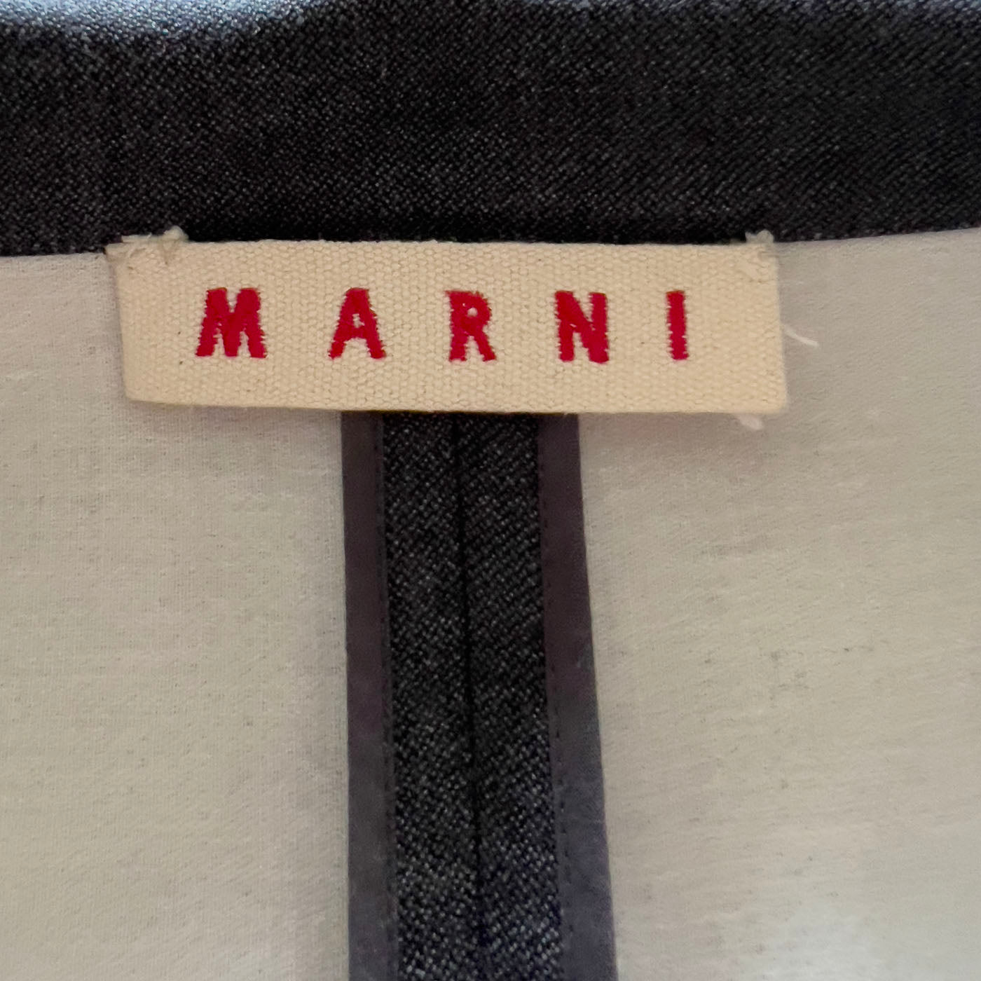 A Marni grey 3/4 sleeved coat with a calf leather belt, displayed on a mannequin with the belt detached and visible.