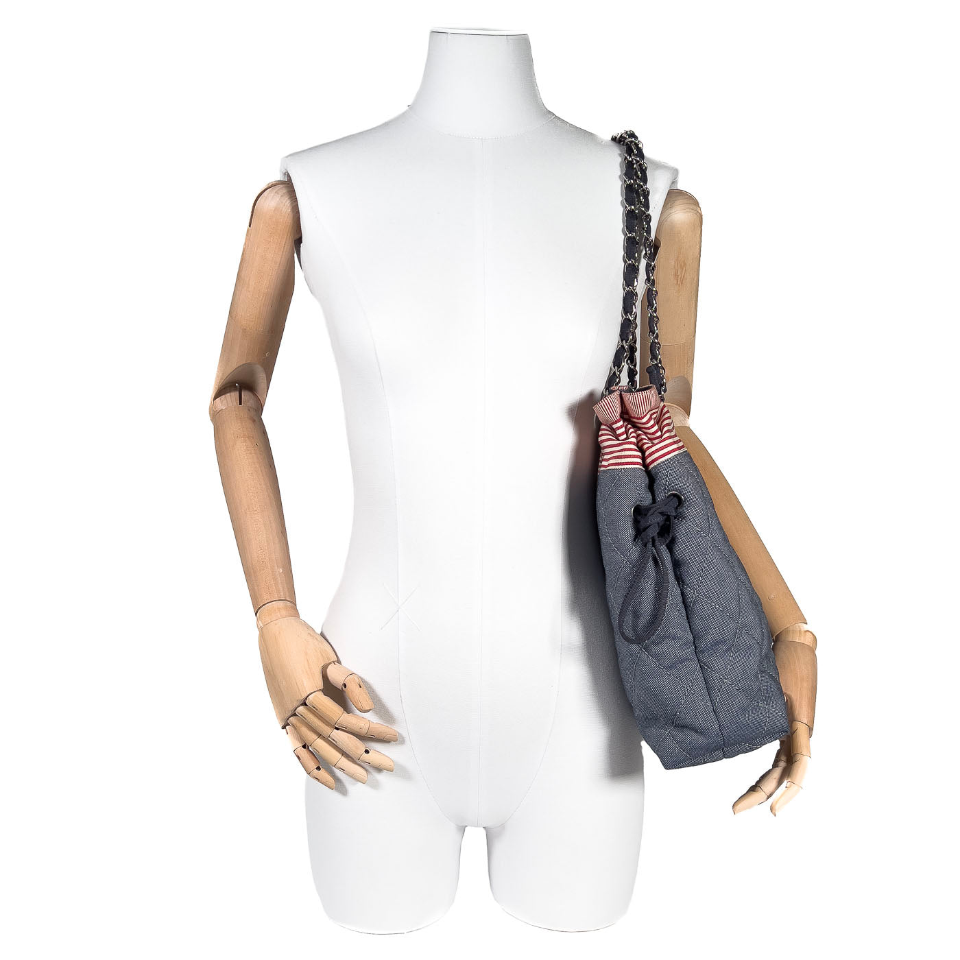Pre-owned Chanel CC Tote Bag displayed on a mannequin torso with blue denim material and red and white striped accents.