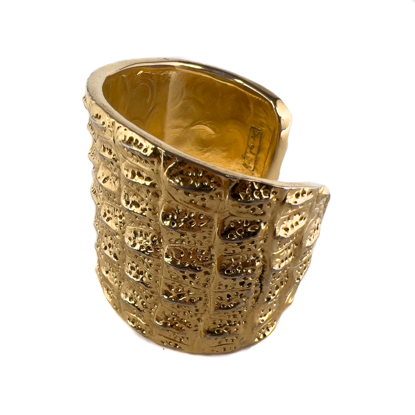 Vintage Yves Saint Laurent YSL Crocodile Pattern Cuff Bracelet Gold Tone. This beauty exemplifies the opulent style characteristic of Yves Saint Laurent. This line of jewelry was designed by Robert Goossens in 1986, as part of a collection honoring the 20th anniversary of Yves Saint Laurent. Pieces from this collection were prominently worn on screen by Penelope Cruz, in the movie Loving Pablo (2017),