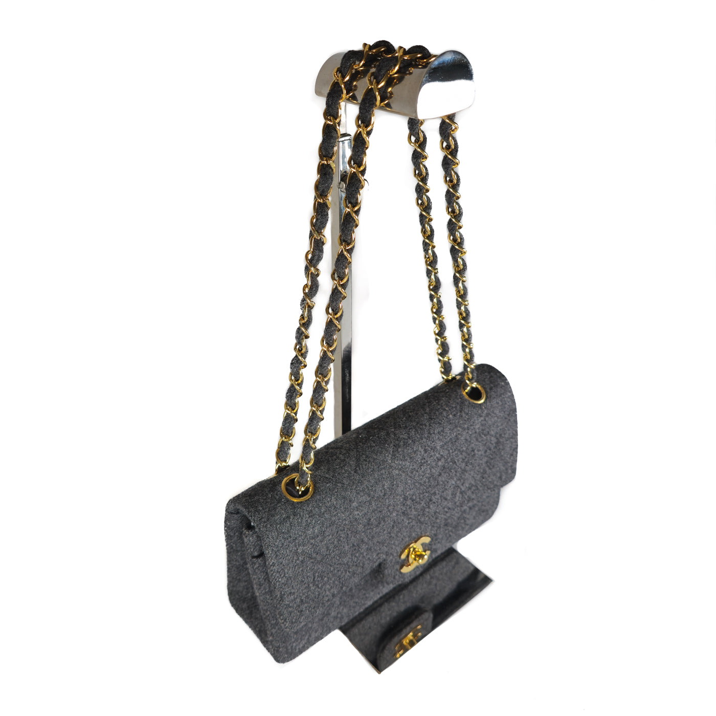 Chanel Vintage Grey Flannel Wool Double Flap Bag 24GHW Small 1990's

A Chanel vintage grey flannel wool double flap handbag with gold plated chain and turn-lock hardware.