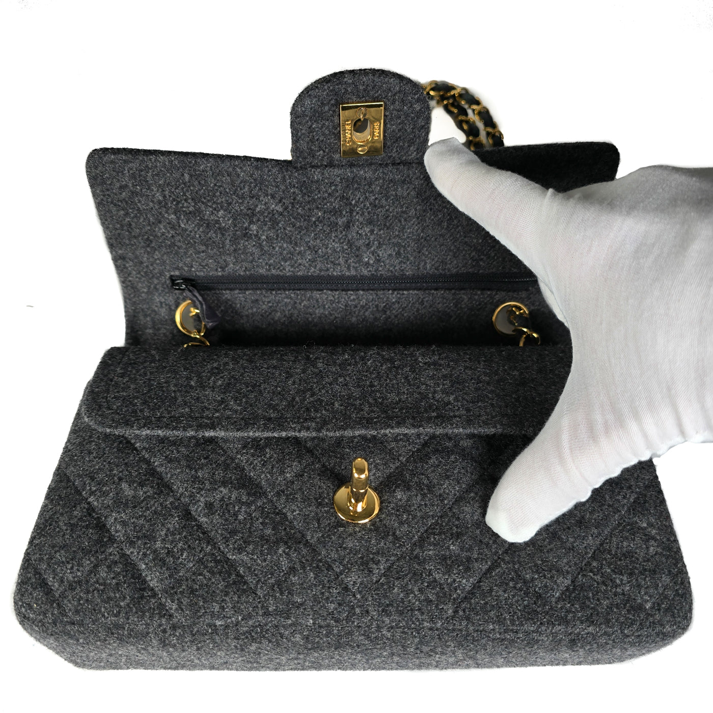 A Chanel vintage grey flannel wool double flap handbag with gold plated chain and turn-lock hardware.