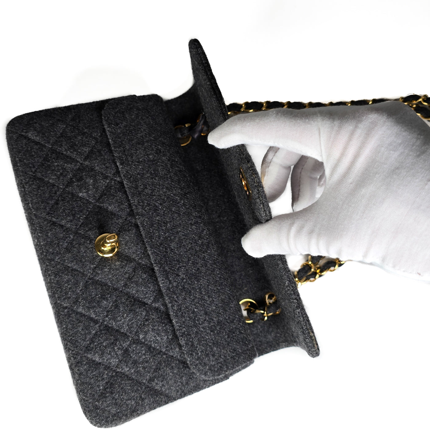 A Chanel vintage grey flannel wool double flap handbag with gold plated chain and turn-lock hardware.