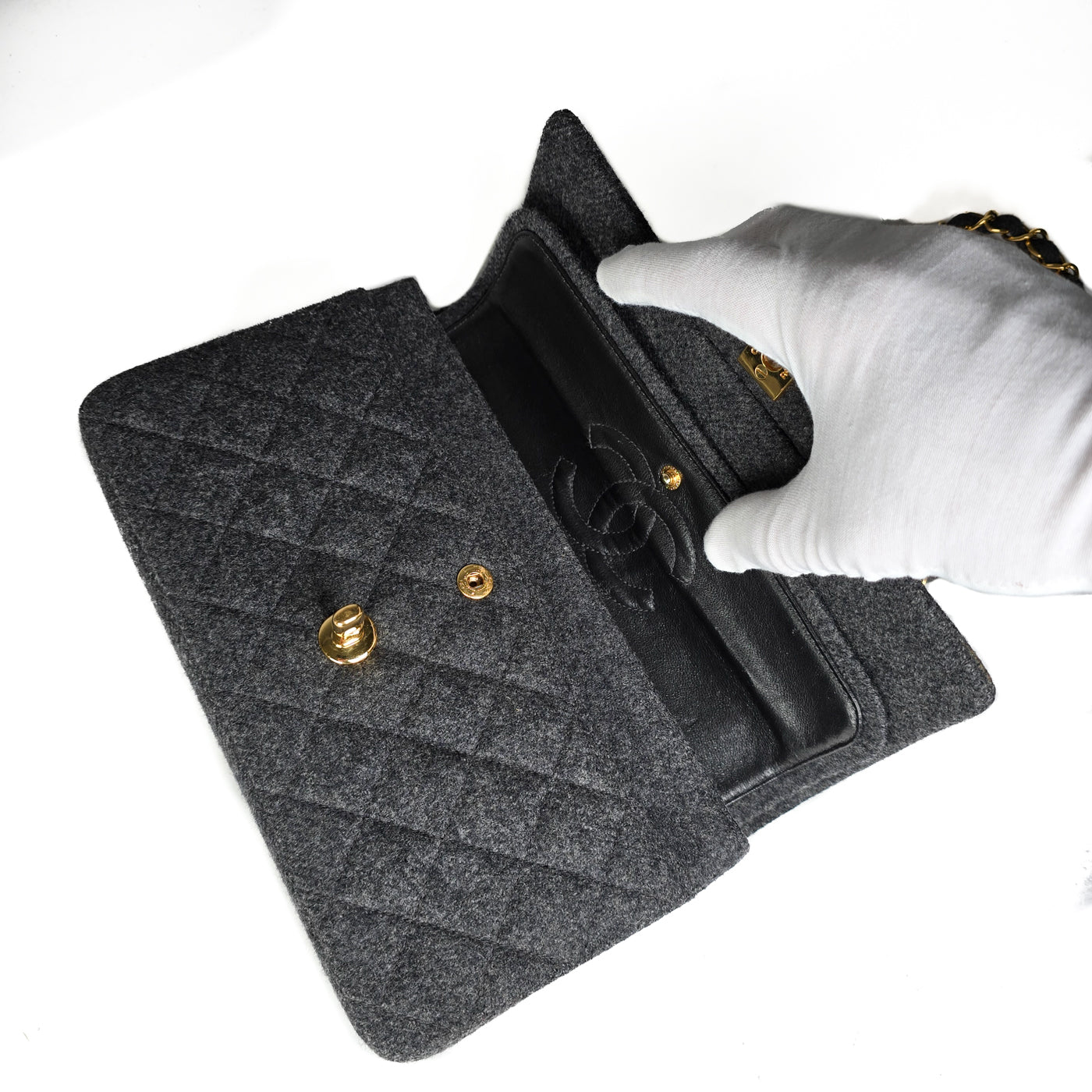 A Chanel vintage grey flannel wool double flap handbag with gold plated chain and turn-lock hardware.