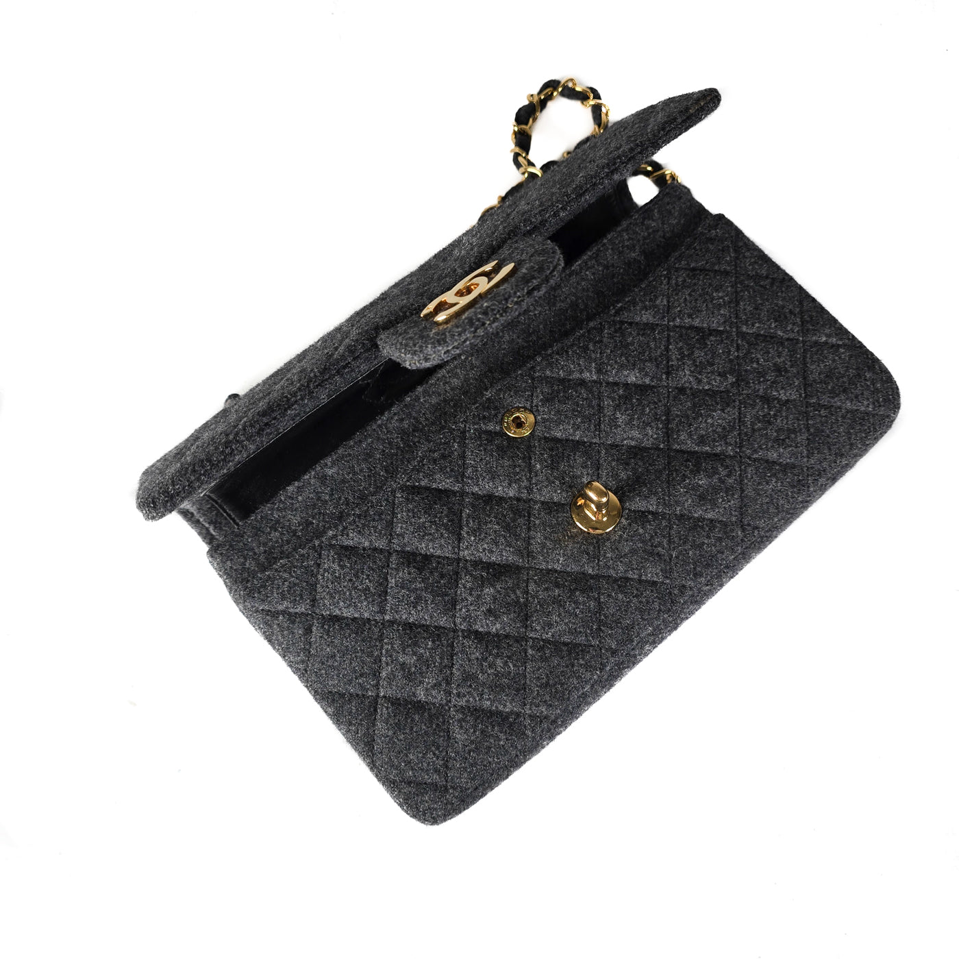 A Chanel vintage grey flannel wool double flap handbag with gold plated chain and turn-lock hardware.