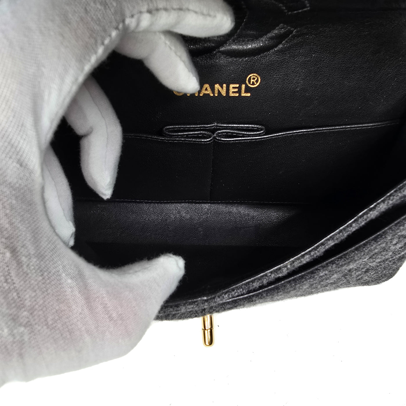 A Chanel vintage grey flannel wool double flap handbag with gold plated chain and turn-lock hardware.