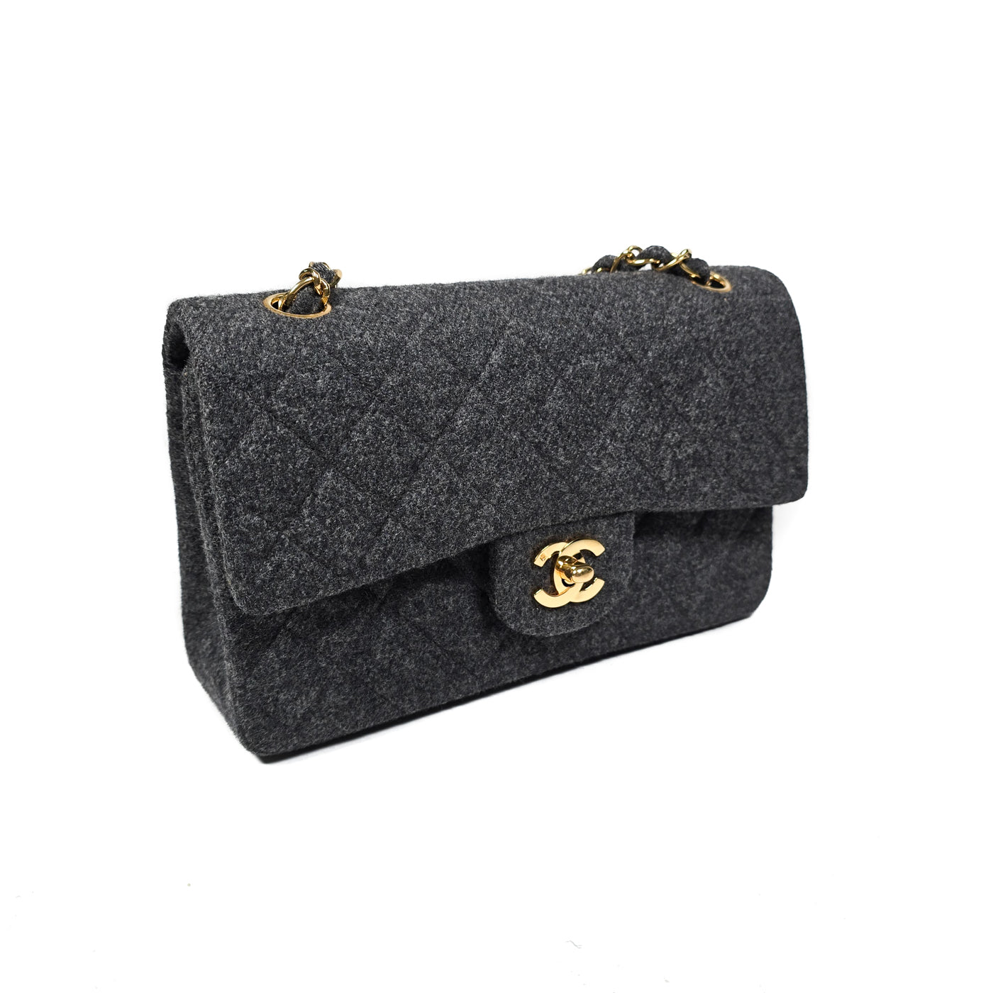 A Chanel vintage grey flannel wool double flap handbag with gold plated chain and turn-lock hardware.